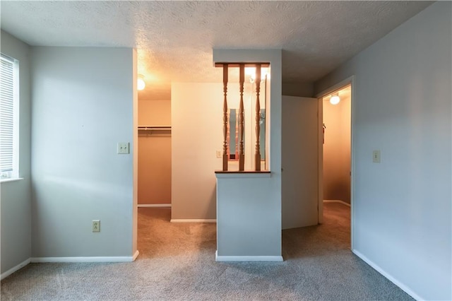 1406 Springleaf Cir SE, Smyrna, GA 30080 - unfurnished bedroom with a spacious closet, carpet floors, a textured ceiling, baseboards, and a closet