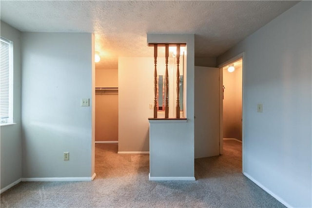 1406 Springleaf Cir SE, Smyrna, GA 30080 - unfurnished bedroom featuring a spacious closet, carpet, baseboards, a textured ceiling, and a closet