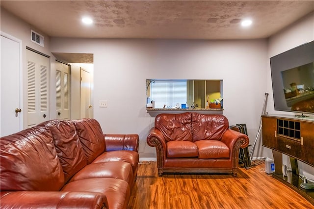 1406 Springleaf Cir SE, Smyrna, GA 30080 - living room featuring wood finished floors, recessed lighting, and baseboards