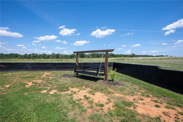 view of yard with a rural view