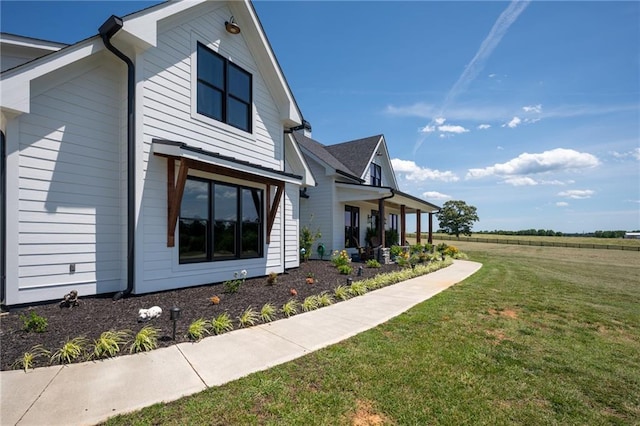 view of home's exterior featuring a lawn