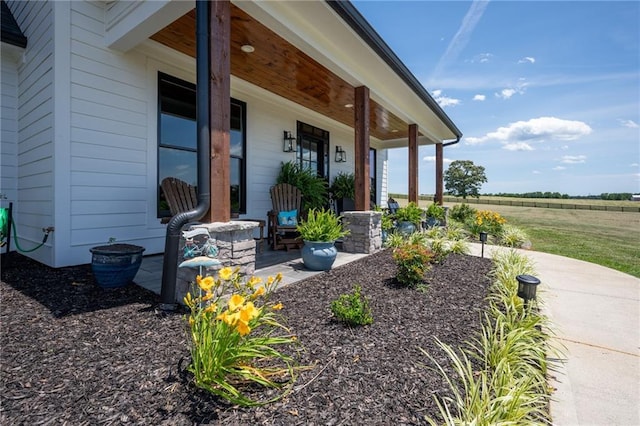 property entrance featuring a porch