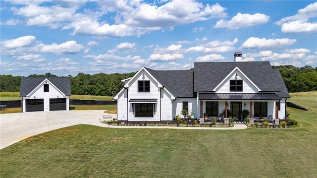 modern inspired farmhouse with a porch and a front yard