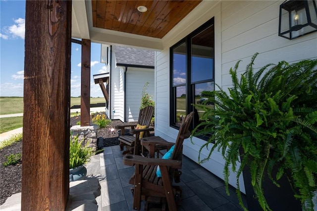 view of patio featuring a porch