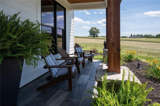 view of patio / terrace with a rural view