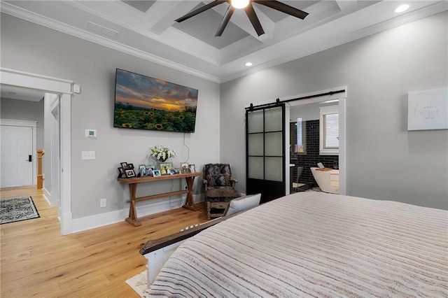 bedroom featuring coffered ceiling, crown molding, light wood-type flooring, ceiling fan, and a barn door