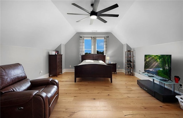 bedroom featuring ceiling fan, lofted ceiling, and light hardwood / wood-style flooring