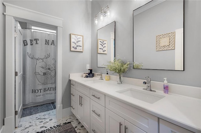 bathroom featuring vanity and curtained shower