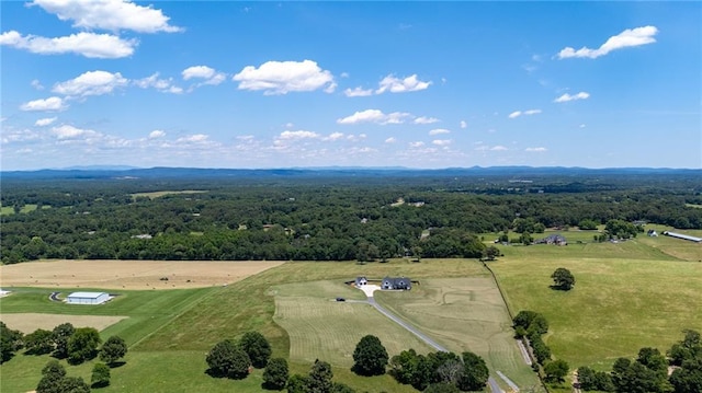 birds eye view of property with a rural view