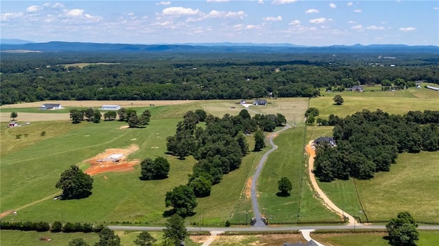 birds eye view of property with a rural view