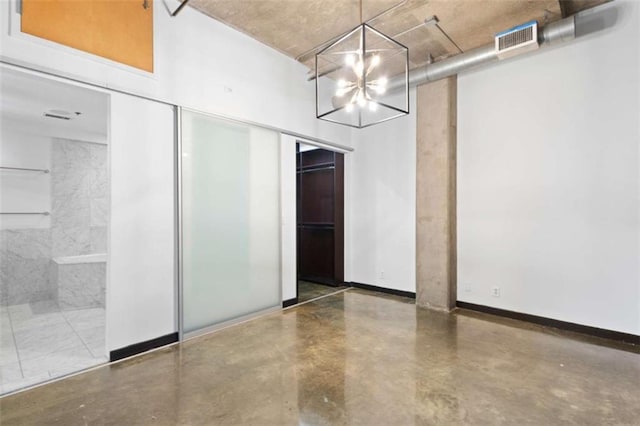 660 Glen Iris Drive # 206 & 109, Atlanta, GA 30308 - unfurnished dining area with a chandelier, finished concrete floors, and baseboards