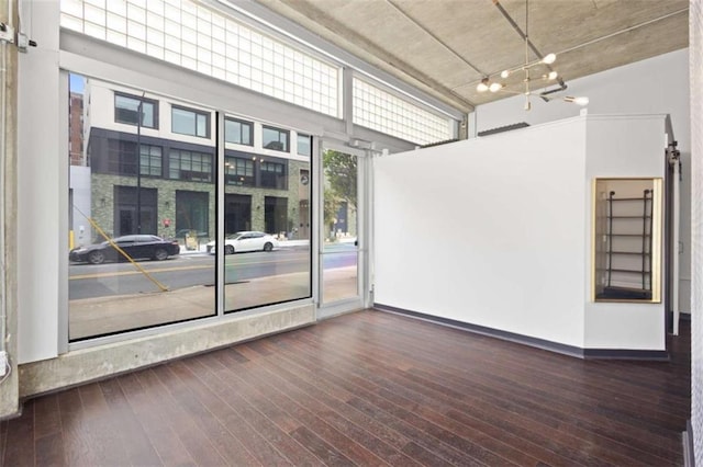 660 Glen Iris Drive # 206 & 109, Atlanta, GA 30308 - empty room featuring hardwood / wood-style flooring, a high ceiling, and baseboards