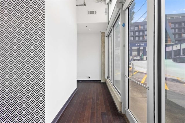 660 Glen Iris Drive # 206 & 109, Atlanta, GA 30308 - hall with a heating unit, dark wood-style floors, an accent wall, and baseboards