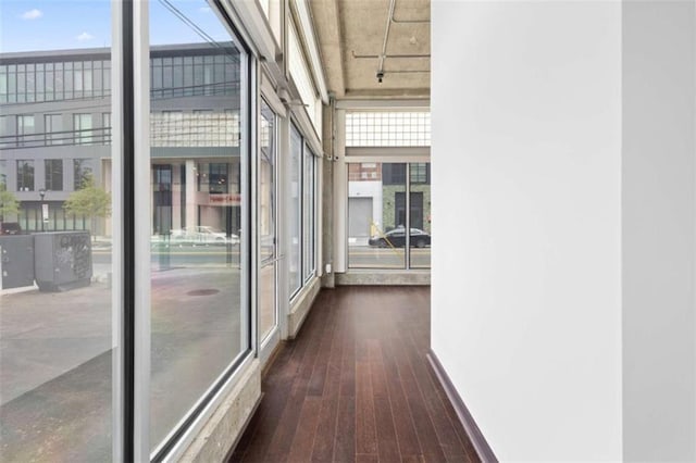 660 Glen Iris Drive # 206 & 109, Atlanta, GA 30308 - hall featuring plenty of natural light, dark wood-type flooring, and baseboards
