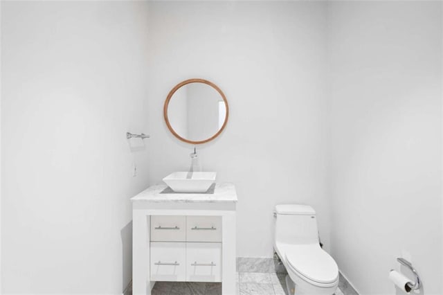 660 Glen Iris Drive # 206 & 109, Atlanta, GA 30308 - bathroom featuring toilet, vanity, and baseboards