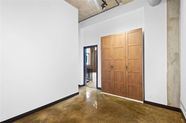 660 Glen Iris Drive # 206 & 109, Atlanta, GA 30308 - unfurnished bedroom with baseboards and finished concrete floors