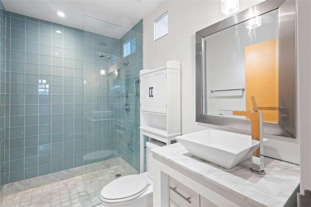 660 Glen Iris Drive # 206 & 109, Atlanta, GA 30308 - bathroom with vanity, a walk in shower, toilet, and recessed lighting