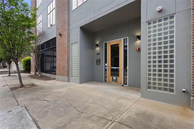 660 Glen Iris Drive # 206 & 109, Atlanta, GA 30308 - doorway to property featuring stucco siding