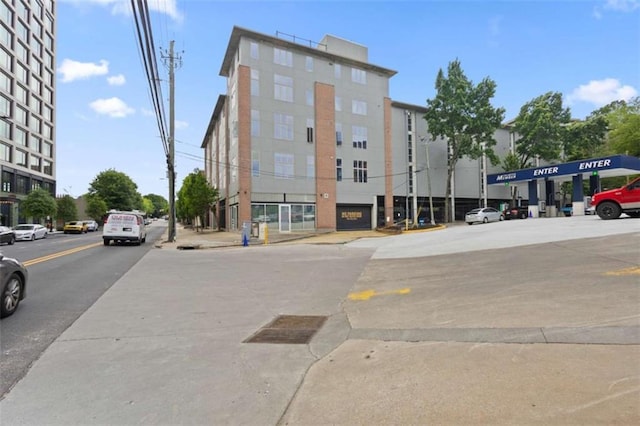 660 Glen Iris Drive # 206 & 109, Atlanta, GA 30308 - view of building exterior featuring uncovered parking