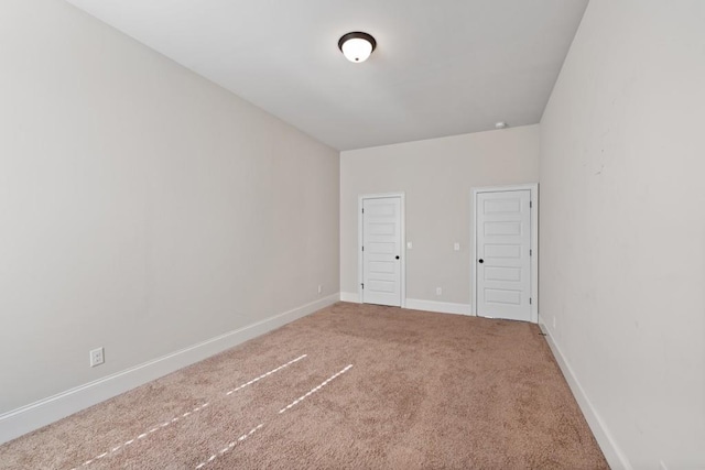 unfurnished bedroom with carpet flooring and a closet