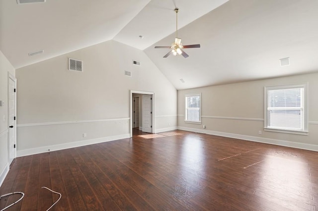 unfurnished living room with ceiling fan, lofted ceiling, and dark wood-type flooring