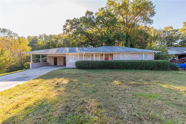 single story home featuring a front lawn and a carport