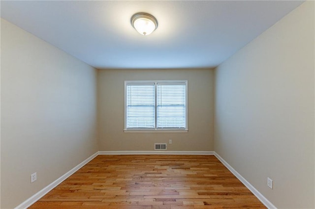 spare room with light wood-type flooring