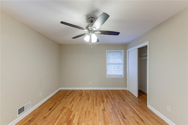 unfurnished bedroom with a closet, ceiling fan, and light hardwood / wood-style flooring