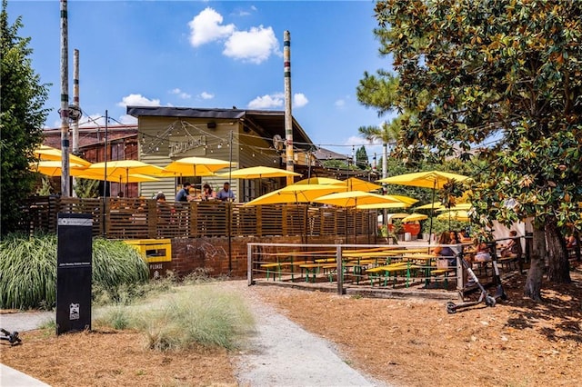 view of home's community with fence