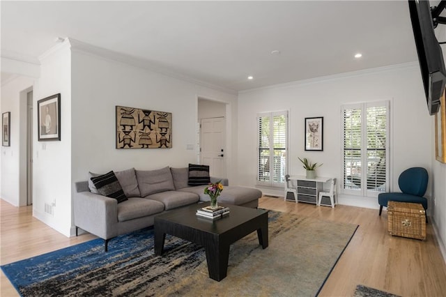 living room with baseboards, wood finished floors, recessed lighting, and ornamental molding