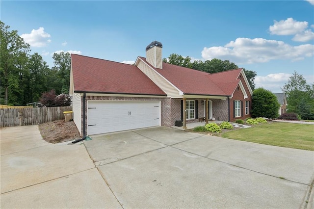 219 Summit Chase Dr, Jefferson, GA 30549 - view of front of property featuring a garage, concrete driveway, a chimney, brick siding, and covered porch