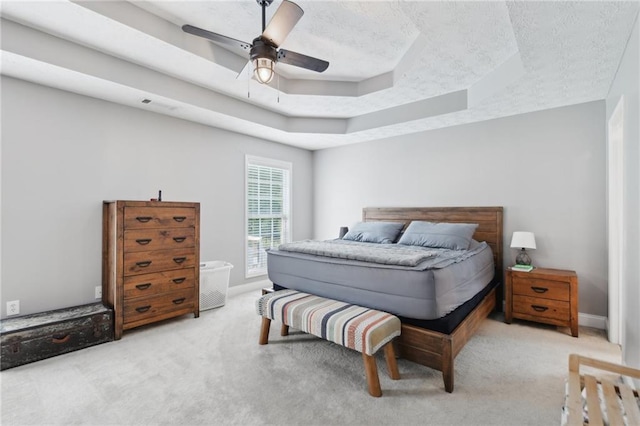 219 Summit Chase Dr, Jefferson, GA 30549 - carpeted bedroom featuring a raised ceiling, ceiling fan, baseboards, and a textured ceiling