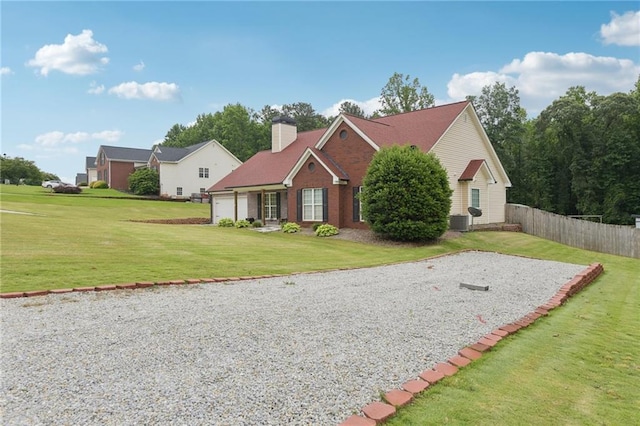 219 Summit Chase Dr, Jefferson, GA 30549 - traditional-style house with an attached garage, central AC unit, a chimney, and driveway
