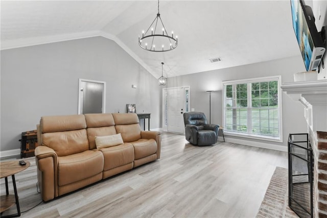 219 Summit Chase Dr, Jefferson, GA 30549 - living area with a chandelier, wood finished floors, baseboards, and high vaulted ceiling