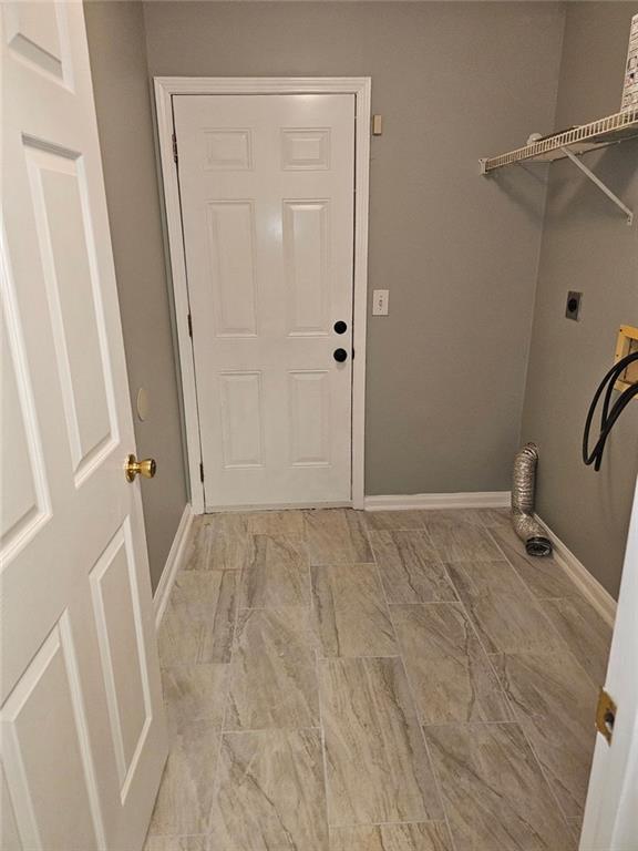 laundry room featuring electric dryer hookup and washer hookup