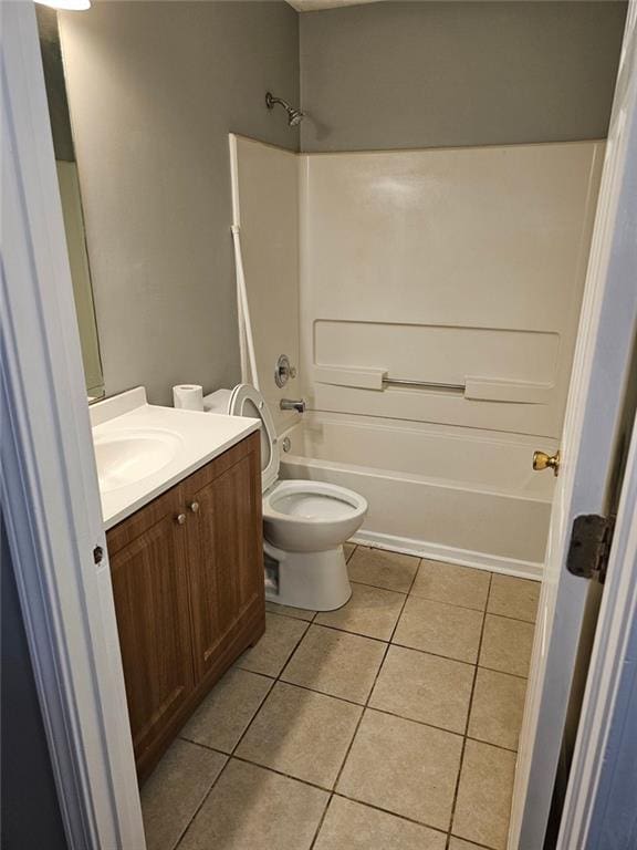 full bathroom featuring tile patterned floors, toilet, tub / shower combination, and vanity