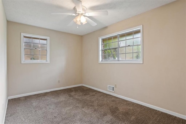 1513 Dupree Rd, Woodstock, GA 30189 - carpeted spare room with a ceiling fan and a textured ceiling