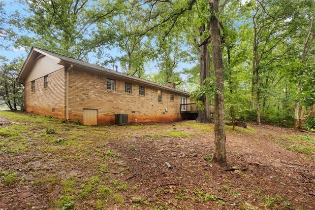1513 Dupree Rd, Woodstock, GA 30189 - back of property featuring crawl space, brick siding, and a wooden deck