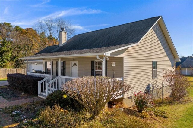 view of front of house with a garage and covered porch