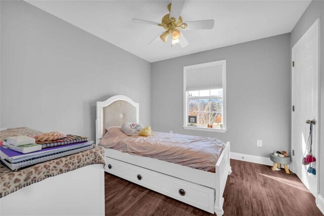 bedroom featuring ceiling fan and dark hardwood / wood-style floors