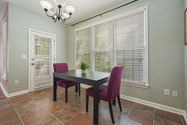 dining area featuring an inviting chandelier