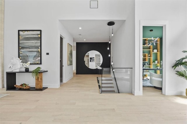 corridor with light hardwood / wood-style floors