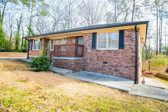 single story home with a patio and a front yard