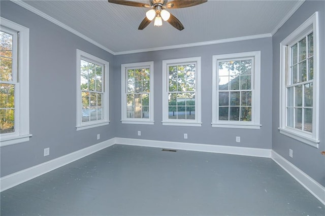 unfurnished sunroom with a healthy amount of sunlight and ceiling fan