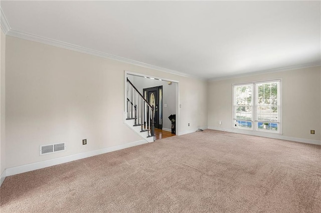 carpeted empty room with ornamental molding