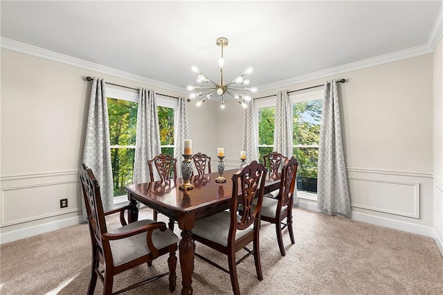 carpeted dining room featuring ornamental molding and a chandelier