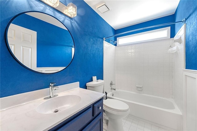 full bathroom with vanity, tile patterned flooring, toilet, and tiled shower / bath