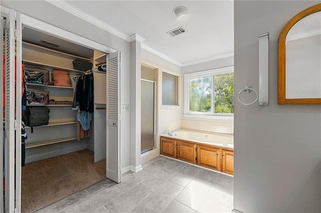 bathroom with ornamental molding and independent shower and bath