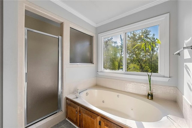 bathroom featuring crown molding and separate shower and tub