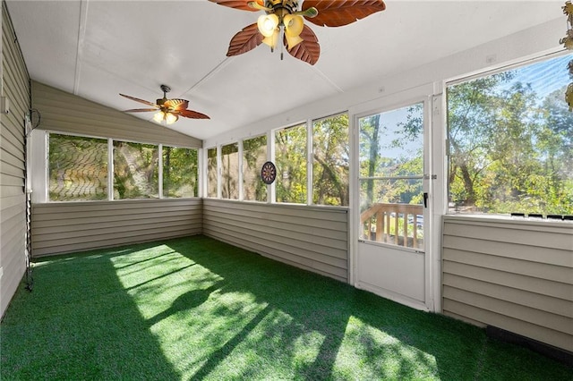 unfurnished sunroom with lofted ceiling and ceiling fan